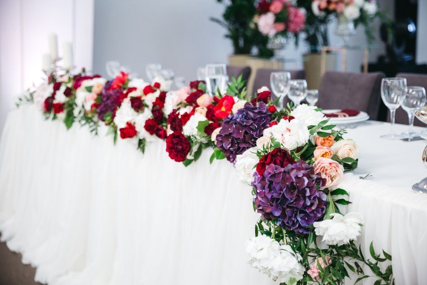 Elegant event table decorated with colorful floral arrangements